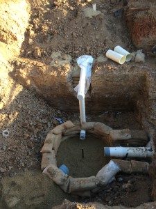 Construction crew preparing manhole base pouring